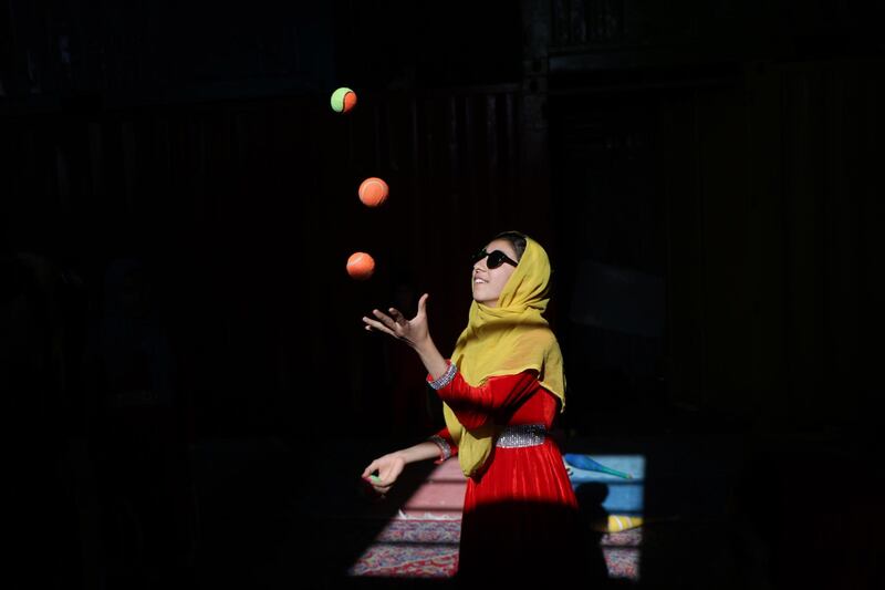 Afghan internally displaced children learn skills to perform in a circus, in Herat, Afghanistan. EPA