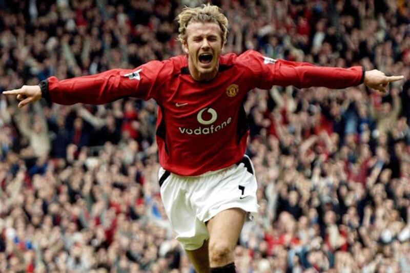 (FILES) In a file picture taken on May 3, 2003 David Beckham celebrates after making it Manchester United 1-Charlton 0 during their English Premier League football match at Old Trafford, in Manchester. David Beckham is to retire from professional football at the end of the season, his representative announced on on May 16, 2013. The 38-year-old midfielder has played for Manchester United, Real Madrid and AC Milan, as well as winning 115 caps for England, and recently won the French Ligue 1 championship with Paris Saint-Germain. AFP PHOTO / PAUL BARKER


