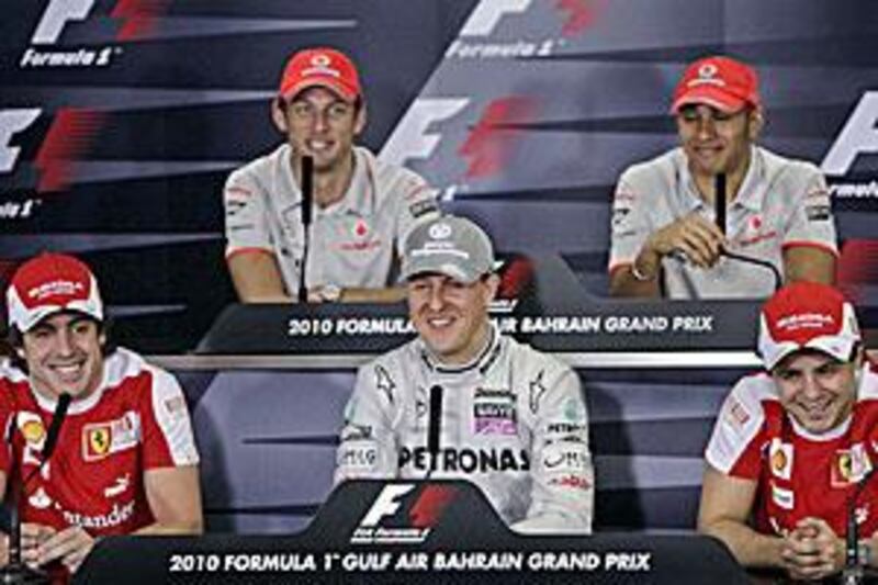 Michael Schumacher, centre, enjoys a moment with his fellow Formula One drivers in Sakhir, Bahrain yesterday.