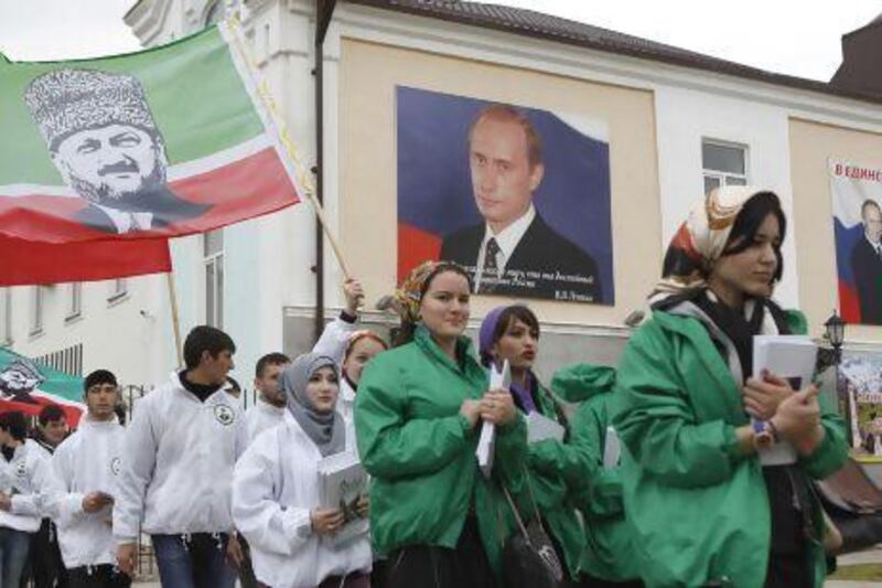 Members of a youth club supporting former Chechen leader Akhmad Kadyrov during a rally in the centre of the Chechen capital Grozny.