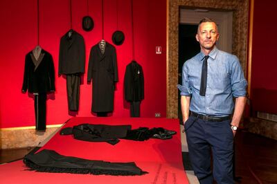 Curator and fashion historian Olivier Salliard at the exhibition. Courtesy Pitti Immagine Uomo