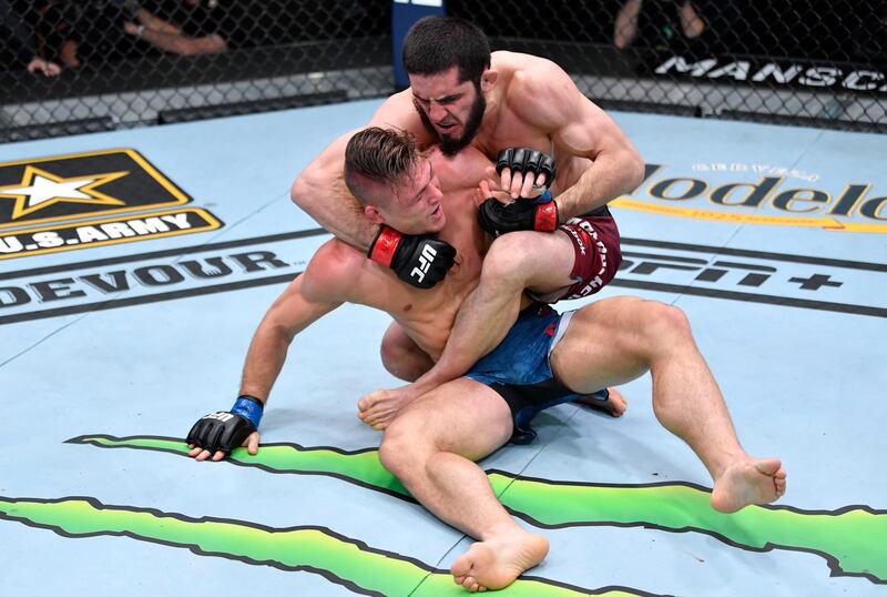 Mar 6, 2021; Las Vegas, NV, USA; Islam Makhachev works for a submission against Drew Dober in their lightweight fight during the UFC 259 event at UFC APEX on March 06, 2021 in Las Vegas, Nevada.  Mandatory Credit: Jeff Bottari/Handout Photo via USA TODAY Sports