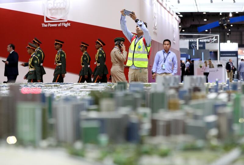 Dubai, United Arab Emirates - November 20, 2019: A visitor takes a picture of a model of Mohammed Bin Rashid Aersospace hub at the Dubai airshow. Wednesday, November 20th, 2017 at Dubai Airshow, Dubai. Chris Whiteoak / The National