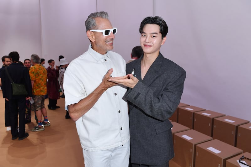 American actor Jeff Goldblum, left, and Korean actor Song Kang arrive at the Prada spring/summer 2023 fashion show during Milan Men's Fashion Week. Getty Images