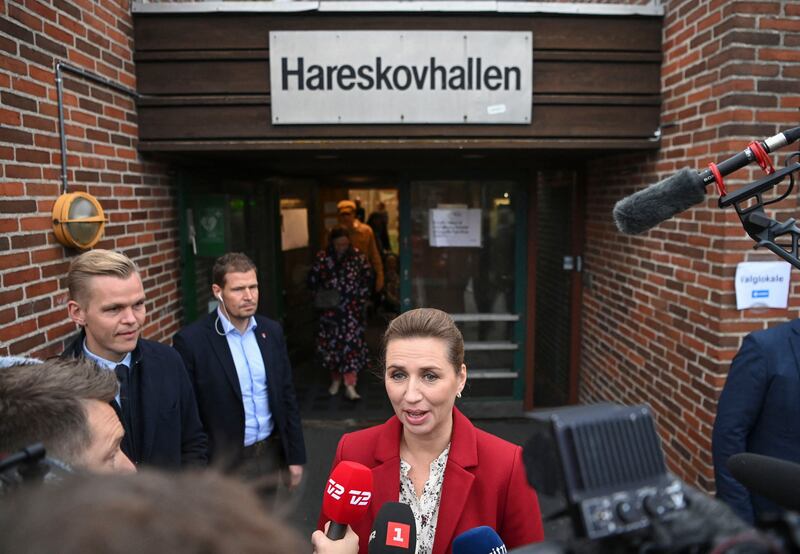 Mette Frederiksen, Prime Minister of Denmark and leader of the Social Democrats, addresses the media after casting her vote in Hareskovhallen. AFP