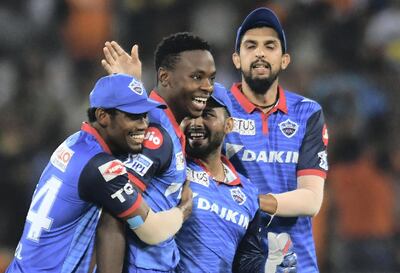 Delhi Capitals cricketer Kagiso Rabada (2L) celebrates with teammates after taking the wicket of unseen Sunrisers Hyderabad batsman David Warner during the 2019 Indian Premier League (IPL) Twenty20 cricket match between Sunrisers Hyderabad and Delhi Capitals at The Rajiv Gandhi International Cricket Stadium in Hyderabad on April 14, 2019. (Photo by NOAH SEELAM / AFP) / IMAGE RESTRICTED TO EDITORIAL USE - STRICTLY NO COMMERCIAL USE