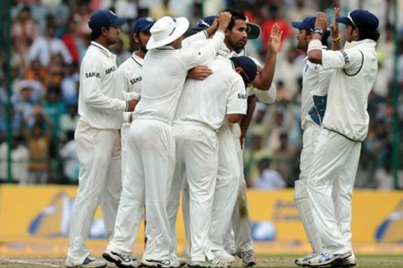 Zaheer Khan, centre, took the crucial wicket of Ricky Ponting, the Australia captain, yesterday.