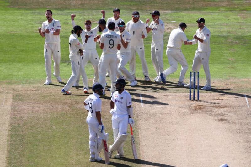 Ollie Robinson, left, celebrates the wicket of Cheteshwar Pujara for 91 after a DRS review. Getty