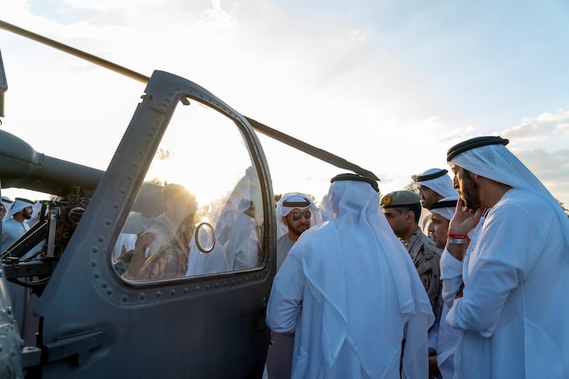 ABU DHABI, UNITED ARAB EMIRATES - January 21, 2019: HH Sheikh Hamdan bin Zayed Al Nahyan, Ruler’s Representative in Al Dhafra Region (C), inspects a new weapon system developed by the UAE for Black Hawk helicopter, at the Sea Palace.
( Rashed Al Mansoori / Ministry of Presidential Affairs )
---
