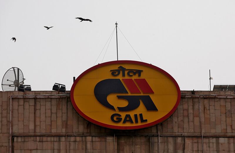 FILE PHOTO: Birds fly past the logo of India's state-owned natural gas utility GAIL (India) Ltd installed on its corporate office building in New Delhi, India, April 26, 2018. REUTERS/Adnan Abidi/File photo  GLOBAL BUSINESS WEEK AHEAD