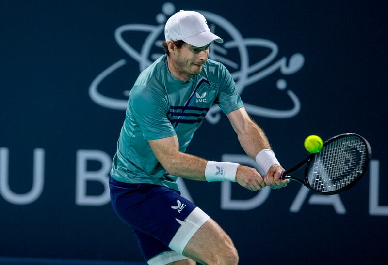 Andy Murray hits a backhand to Dan Evans during their quarter-final match at the Mubadala World Tennis Championship at Zayed Sports City, Abu Dhabi on December 16, 2021. Victor Besa / The National