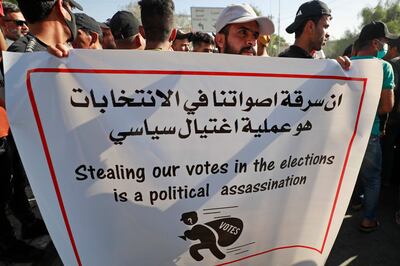 Iraqi supporters of the pro-Iran Hashed al-Shaabi alliance take part in a protest denouncing the results of Iraq's parliamentary elections in Baghdad on October 19. Ahmad Al-Rubaye / AFP