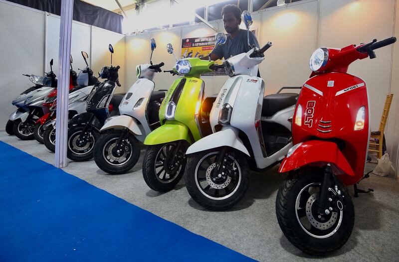 Electric scooters on display at Bengaluru. Indian banks are reluctant to finance EVs. EPA