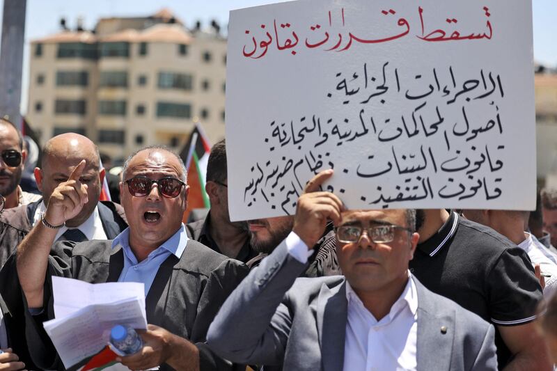Palestinian lawyers demonstrate in front of the prime minister's office in Ramallah in the West Bank, on Monday.  AFP