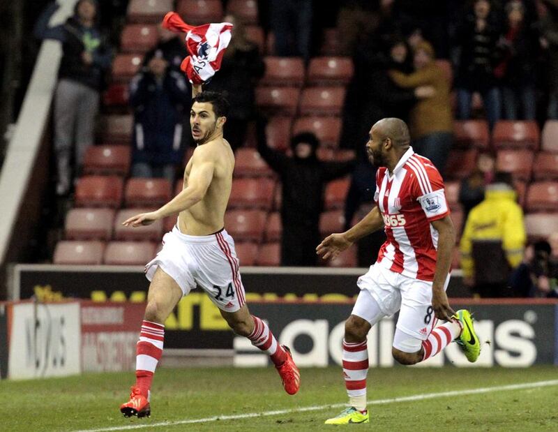 Stoke City's Oussama Assaidi, left, celebrates his late goal, which lifted his team to a 3-2 victory over Chelsea on Saturday. Lindsey Parnaby / AFP

