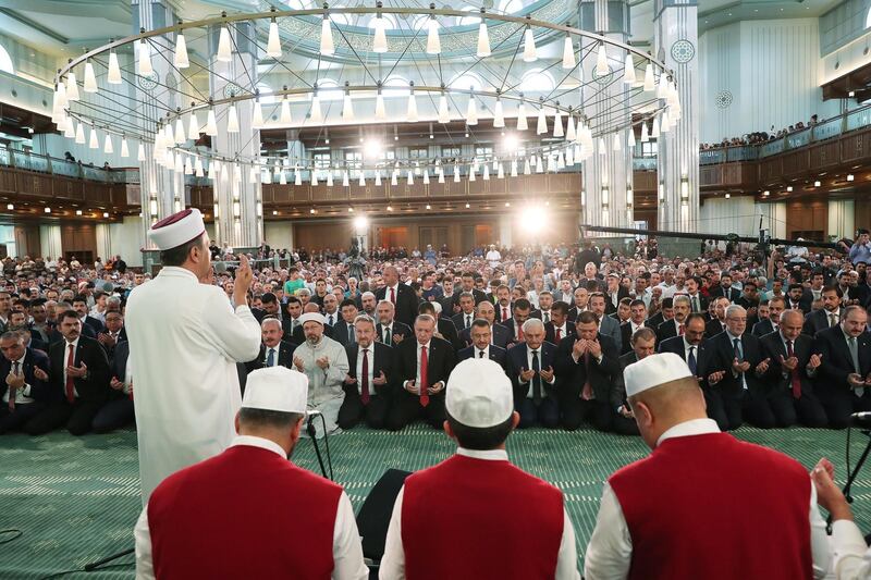 Turkish President Recep Tayyip Erdogan (back-C), praying on the third anniversary of the failed coup attempt at the Millet (Nation) mosque in Ankara, Turkey.  EPA