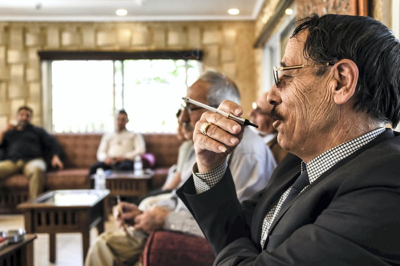 Baalbek, Lebanon, 10 October 2020. Abu Hassan Jaafar, smoking a cigarette at one of his homes in Baalbek. Elizabeth Fitt for The National