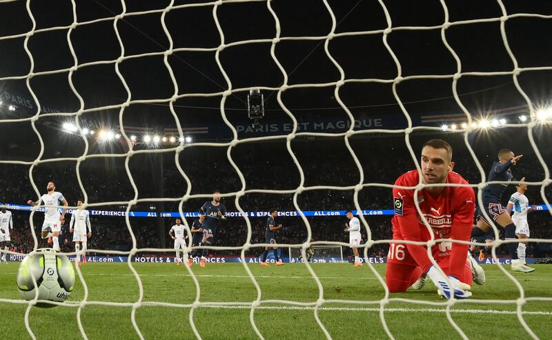 Marseille goalkeeper Pau López looks on after failing to stop Kylian Mbappe's penalty. AFP