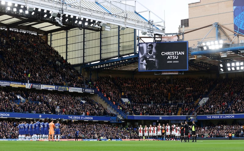 A minute's silence in memory of former Chelsea player Christian Atsu at Stamford Bridge, West London, England, on February 18, 2023. AFP
