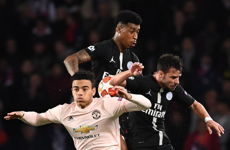 Manchester United forward Mason Greenwood, left, fights for the ball with Paris Saint-Germain's French defender Presnel Kimpembe. AFP