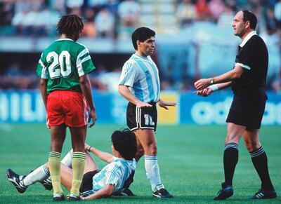 MILAN - JUNE 8: Referee Michel Vautrot of Sweden with Diego Maradona of Argentina during the FIFA World Cup Group B match between Argentina and Cameroon on June 8, 1990 in Milan, Italy. (Photo by Bongarts/Getty Images)