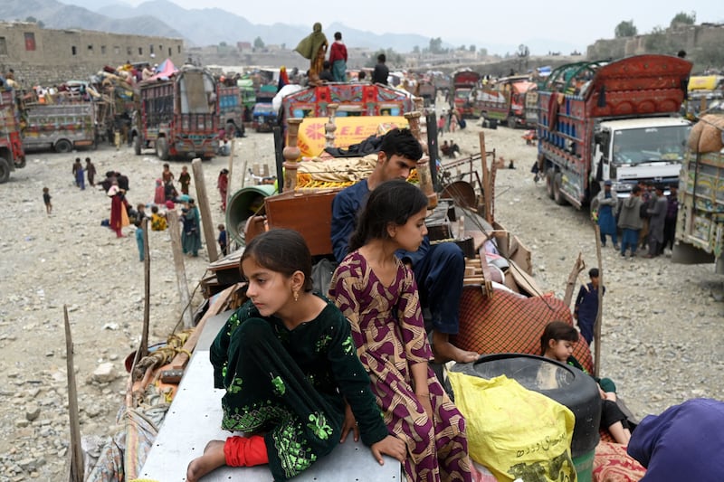 Afghan refugees arrive with their belongings on trucks from Pakistan at the Afghanistan-Pakistan border. Thousands faced the threat of detention and deportation on November 1. AFP