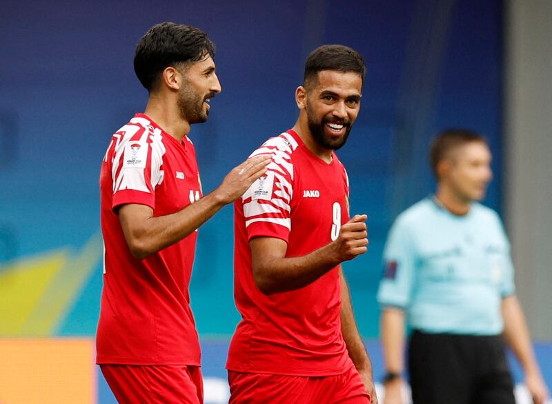 Jordan's Yazan Al Naimat celebrates scoring their first goal with Ali Olwan. Reuters