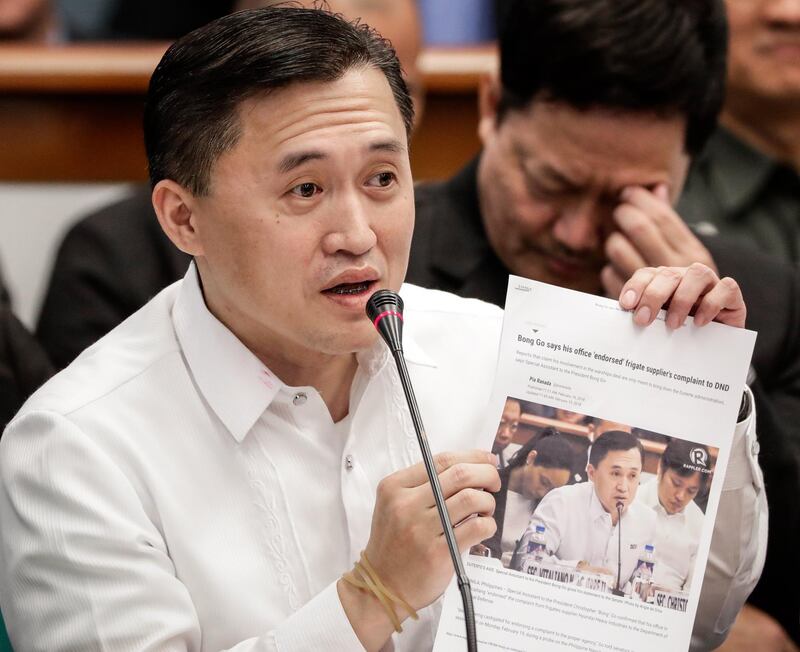 epa06542076 Special Assistant to the President Christopher 'Bong' Go shows a document he described as 'fake news' during a hearing at the Senate building in Pasay City, south of Manila, Philippines, 19 February 2018. The Senate is investigating the 16 billion Philippine Peso (304 million US Dollar) acquisition of two Philippine Navy frigates as part of the Armed Forces of the Philippines'Pasay City (AFP) modernization program.  EPA/MARK R. CRISTINO