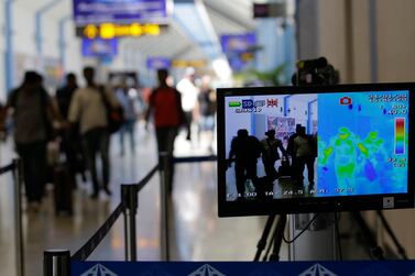 A thermal scanner shows the temperature of arriving passengers at Bandaranaike International Airport in Colombo, Sri Lanka. EPA