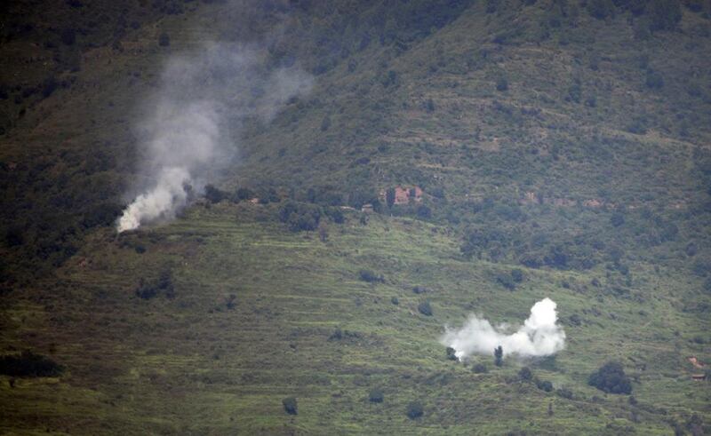 Smoke rises following alleged shelling by Indian troops in the Nakial Sector of Pakistan-administered Kashmir on August 18. Sajjad Qayyum / AFP