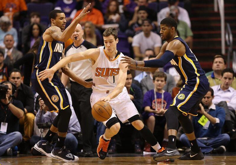 Goran Dragic, centre, had 21 points for the Suns on Wednesday. Christian Petersen / Getty Images / AFP