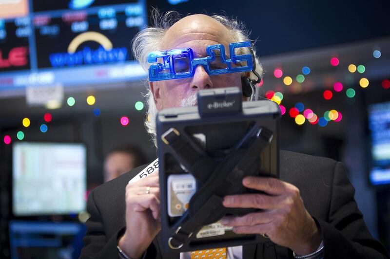 Trader Peter Tuchman works on the floor of the New York Stock Exchange while wearing 2015 novelty glasses on New Year's Eve. Carlo Allegri / Reuters