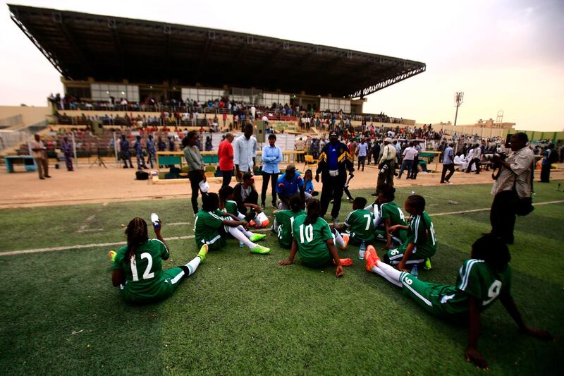 Tahadi players listen to coach instructions ahead of the Sudanese Women Football League match between Tahadi and Difaa, in the capital Khartoum. AFP