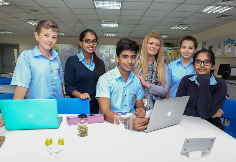 Kayleigh Moss, assistant head of science at Emirates International School Meadows, with her students (from left) Amr Kanan, Aashlesha Galla, Kabir Malhotra, Talia Alhammoud and Anannya Sivakumar. Victor Besa for The National