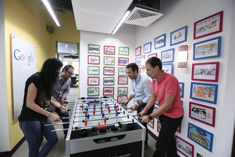 Employees play a round of foosball at the Google office in Dubai Media City. Sarah Dea/The National