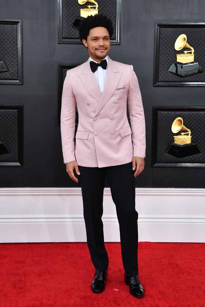 South African comedian Trevor Noah chose a lighter shade of pink for his tuxedo. AFP