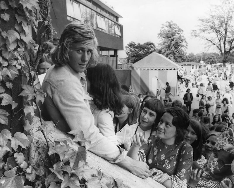 Sweden's five-time singles champion Bjorn Borg is surrounded by young fans in 1973.