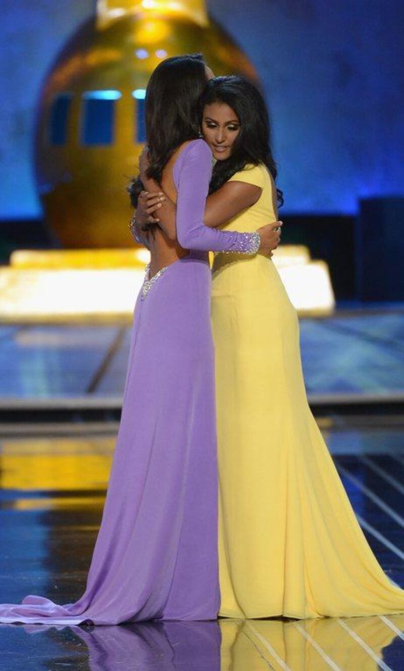 Miss America 2014 contestant Miss New York Nina Davuluri (R) and Miss California Crystal Lee embrace during the Miss America Competition at Boardwalk Hall Arena on September 15, 2013 in Atlantic City, New Jersey. Michael Loccisano/Getty Images