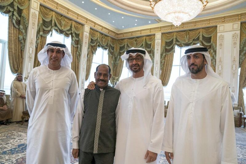 Sheikh Mohammed bin Zayed, Crown Prince of Abu Dhabi and Deputy Supreme Commander of the Armed Forces, bids farewell to worker  Paninkonhi Mohiuddin, who has been serving for more than 40 years at Abu Dhabi Crown Prince Court and has been an example of a dedicated and diligent worker. Courtesy Crown Prince Court - Abu Dhabi