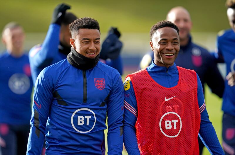 England's Jesse Lingard, left, and Raheem Sterling. PA