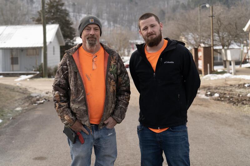 Larry and Andy Endicott pose at a construction site in Hamlin, West Virginia. The father and son are crew chiefs with Revitalise Appalachia, an organisation that provides green construction jobs to those in need. Willy Lowry / The National