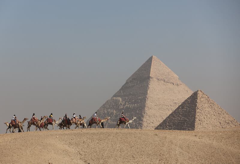 Camel rides are a popular activity at the pyramids. Reuters