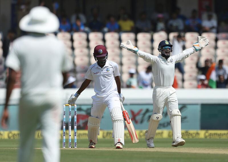 Indian wicketkeeper Rishabh Pant successfully appeals for the dismissal of West Indies' player Kieran Powell, bowled by Kuldeep Yadav, during the first day of the second cricket test match between India and West Indies in Hyderabad, India.