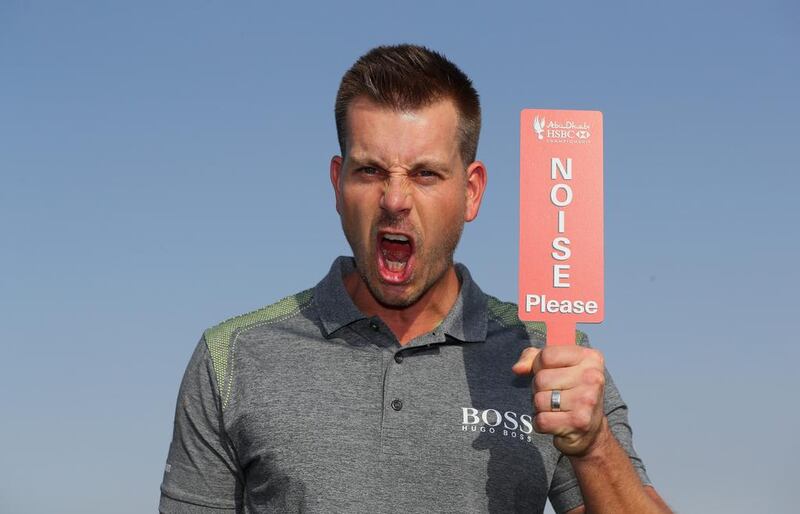 Henrik Stenson of Sweden pictured with a "Noise Please" sign on the driving range prior to the Abu Dhabi HSBC Championship at Abu Dhabi Golf Club on January 17, 2017 in Abu Dhabi, UAE. Andrew Redington / Getty Images
