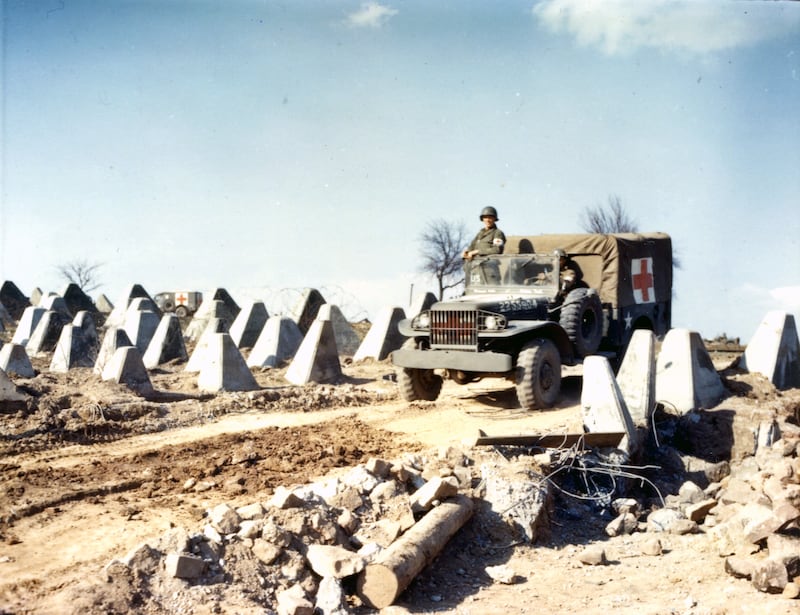 An American WC51 Dodge medic truck on a bulldozed road through rows of 'dragon's teeth' on the Siegfried Line (also known as the West Wall), 1945. The so-called teeth were concrete structures a little more than a metre tall and designed to impede tank movements. Getty Images