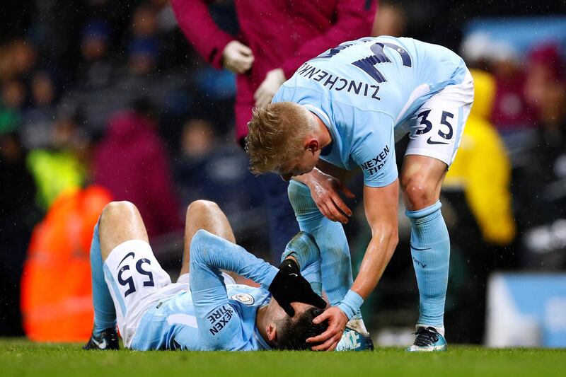 Soccer Football - Premier League - Manchester City vs West Bromwich Albion - Etihad Stadium, Manchester, Britain - January 31, 2018   Manchester City's Oleksandr Zinchenko checks on injured team mate Brahim Diaz      Action Images via Reuters/Jason Cairnduff    EDITORIAL USE ONLY. No use with unauthorized audio, video, data, fixture lists, club/league logos or "live" services. Online in-match use limited to 75 images, no video emulation. No use in betting, games or single club/league/player publications.  Please contact your account representative for further details.