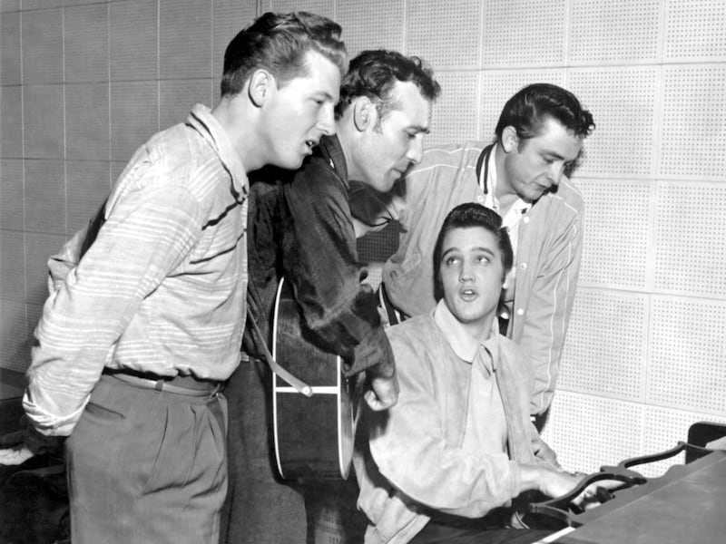 Left to right: Jerry Lee Lewis, Carl Perkins, Elvis Presley and Johnny Cash in 1956 at Sun Studios in Tennessee. The impromptu jam session resulted in an album titled The Million Dollar Quartet. Michael Ochs Archives / Getty Images

