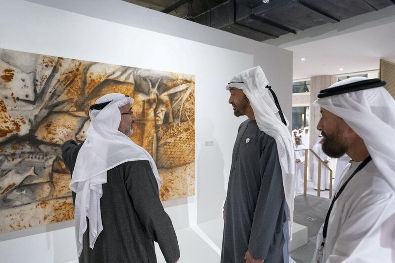 ABU DHABI, UNITED ARAB EMIRATES - December 05, 2018: HH Sheikh Mohamed bin Zayed Al Nahyan, Crown Prince of Abu Dhabi and Deputy Supreme Commander of the UAE Armed Forces (C), speaks with an artist while visiting the Qasr Al Hosn Festival.
( Ryan Carter / Ministry of Presidential Affairs )
---