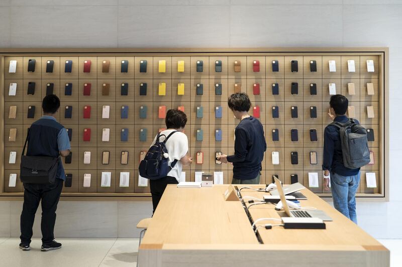 Customers shop at the Apple Marunouchi store in Tokyo. Getty Images