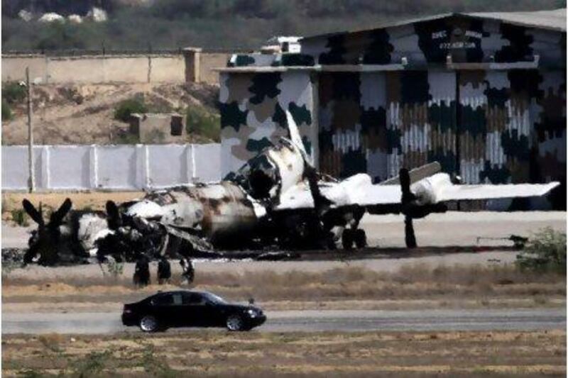 The wreckage of a Pakistan Navy aircraft is seen in Karachi yesterday after a team of Taliban militants attacked and occupied the facility for 15 hours, destroying two US-supplied planes and killing 12 security officers.